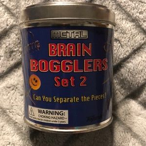 Toy Smith Metal Brain Boggler Set 2. Tin canister holds 5 different puzzles.